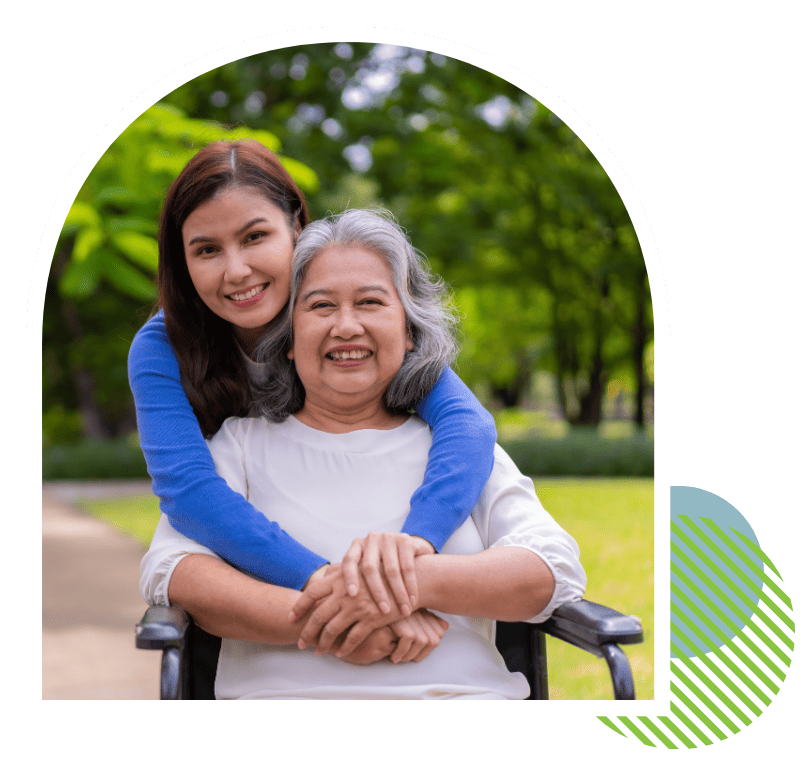 Compassionate personal caregiver assisting a smiling senior woman with daily support services in Putnam County, FL
